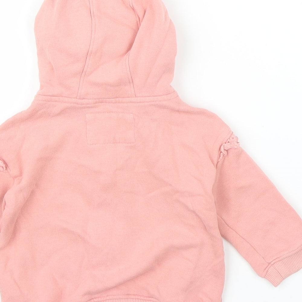 Brand and care label for Next girls’ pink full zip jumper, size 9-12, months