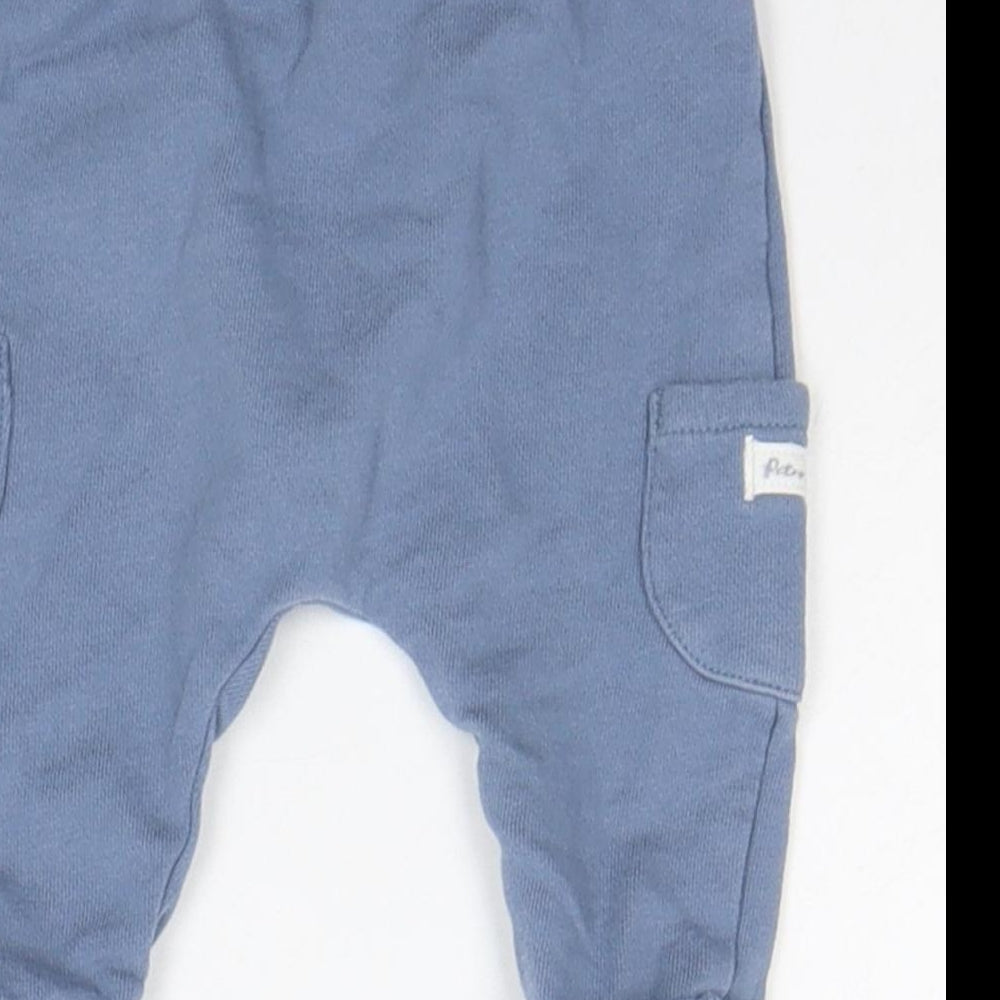 Brand and care label for Tu girls’ blue jogger trousers, size 0-3, months - elastic waist band