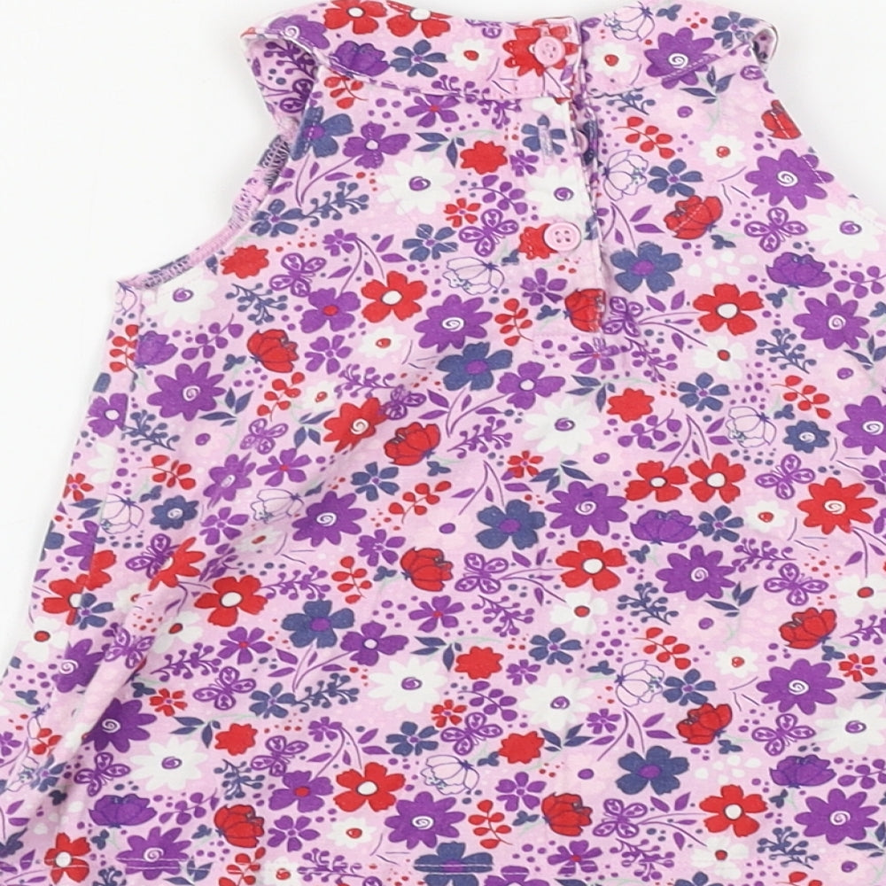 Brand and care label for Mini Club girls’ pink floral a-line, size 3-6, months
