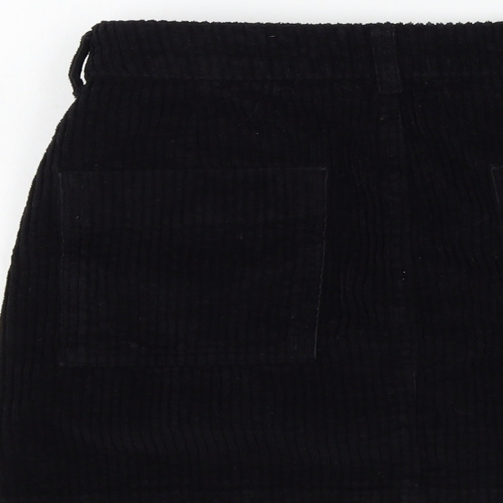 Brand and care label for BDG women’s black a-line skirt, size S