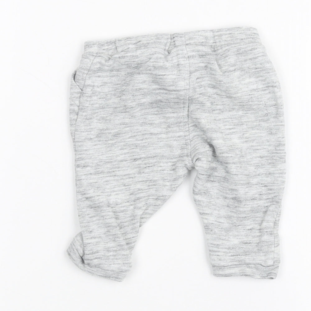 Brand and care label for Next Baby Grey sweatpants, size 3-6, Months