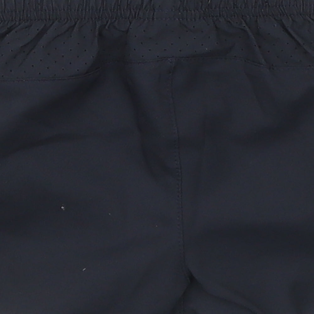 Brand and care label for Umbro boys’ black cropped trousers, size 3-6, months