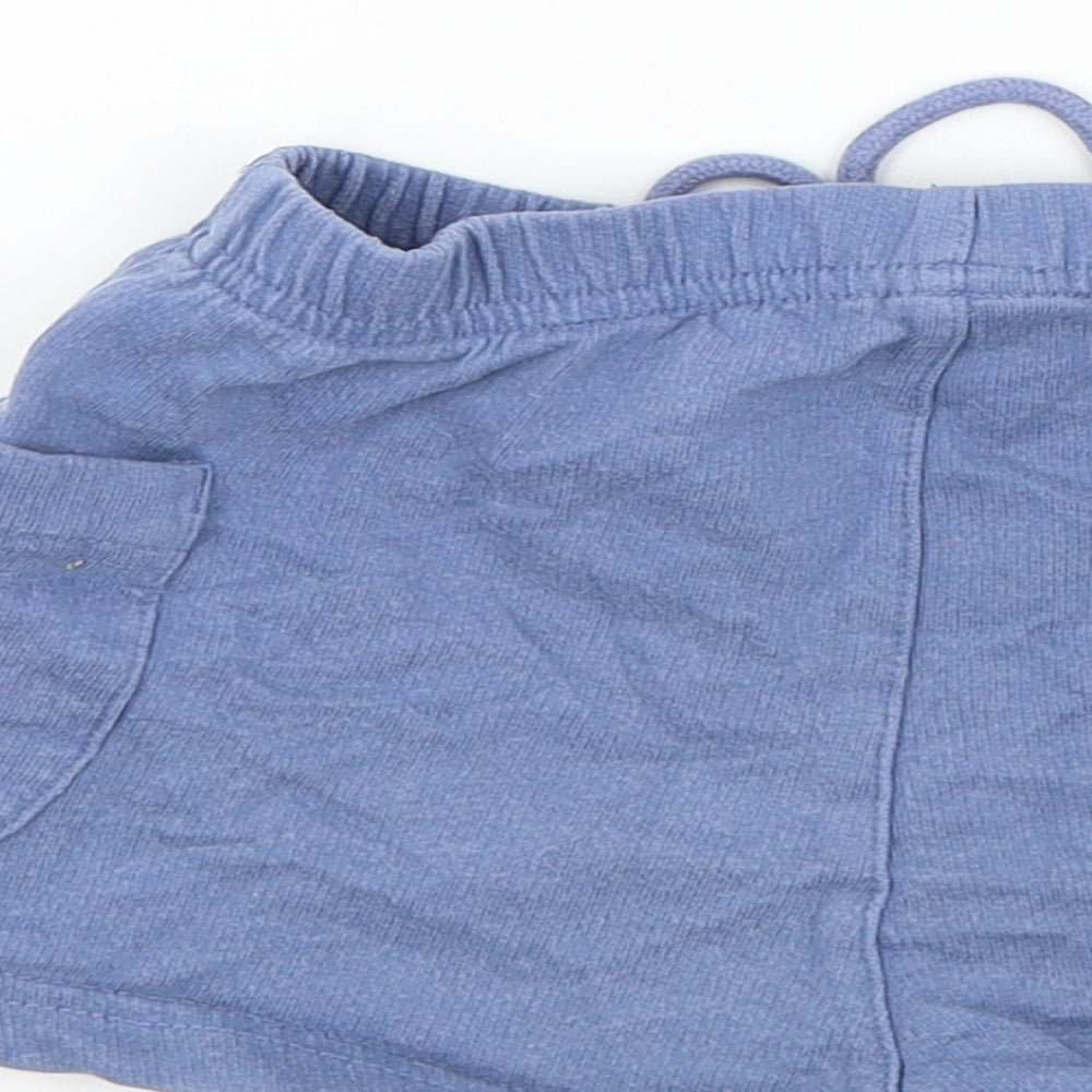 Brand and care label for Gap boys’ blue colourblock jogger trousers, size 12-18, months