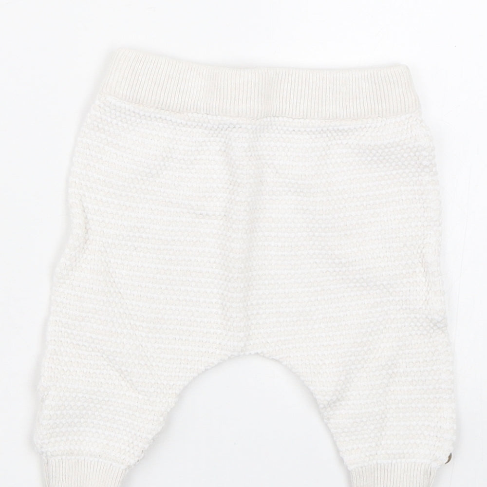 Brand and care label for Mothercare Baby White sweatpants, size 0-3, Months