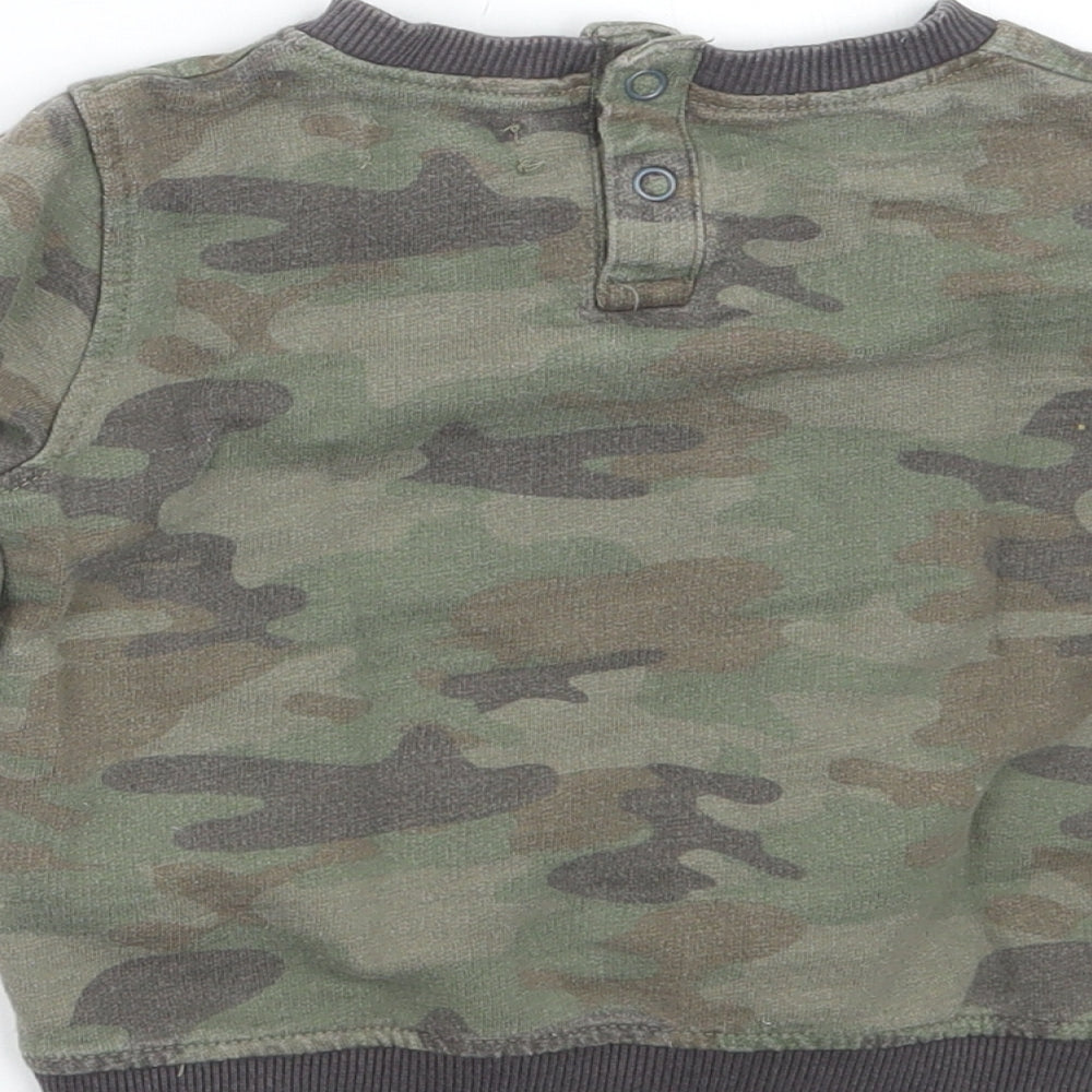 Brand and care label for Babaluno boys’ green camouflage jumper, size 12-18, months