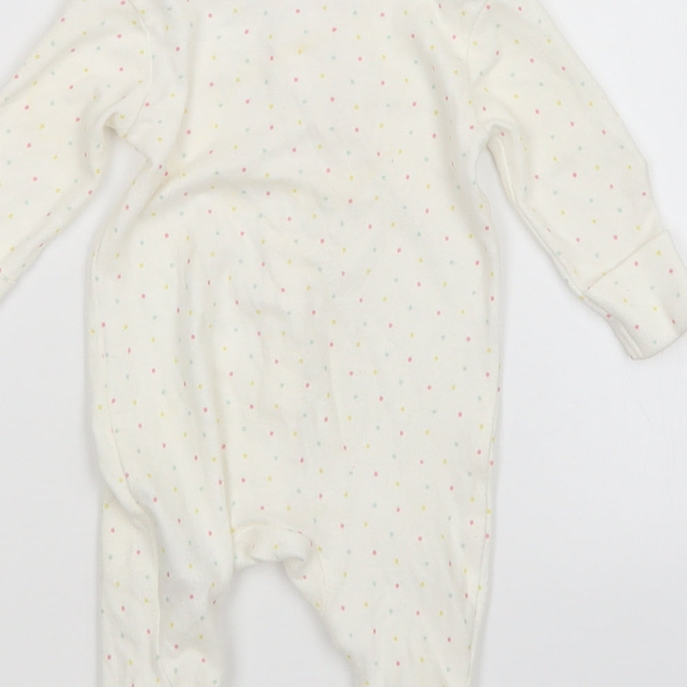 Brand and care label for Early Days girls’ white polka dot babygrow one-piece size newborn
