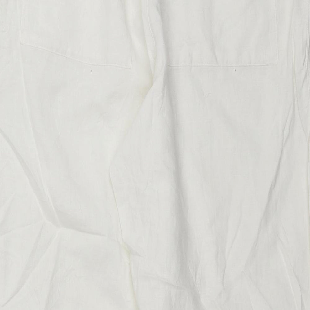 Brand and care label for ESPRIT women’s white trousers, size UK 30, in, 26-inch leg