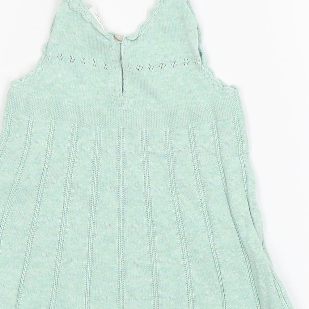 Brand and care label for Next girls’ green jersey jumper dress, size 3-6, months