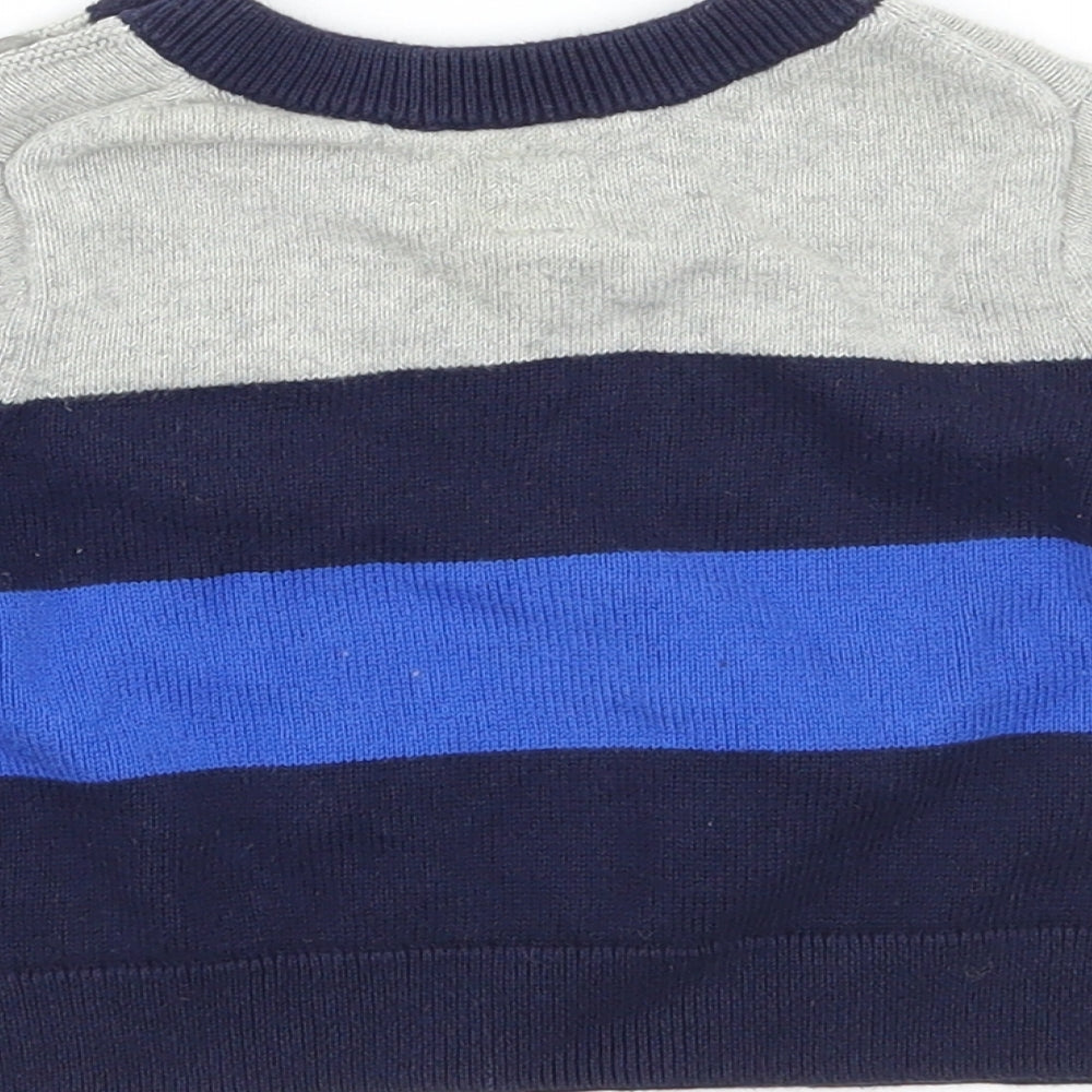 Brand and care label for Gap boys’ blue striped jumper, size 3-6, months