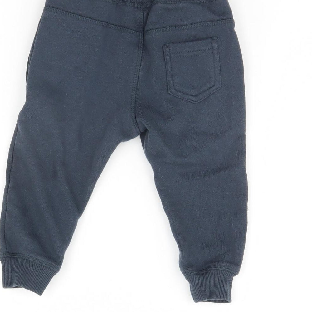 Brand and care label for Very Baby Blue Jogger Trousers, size 12, Months