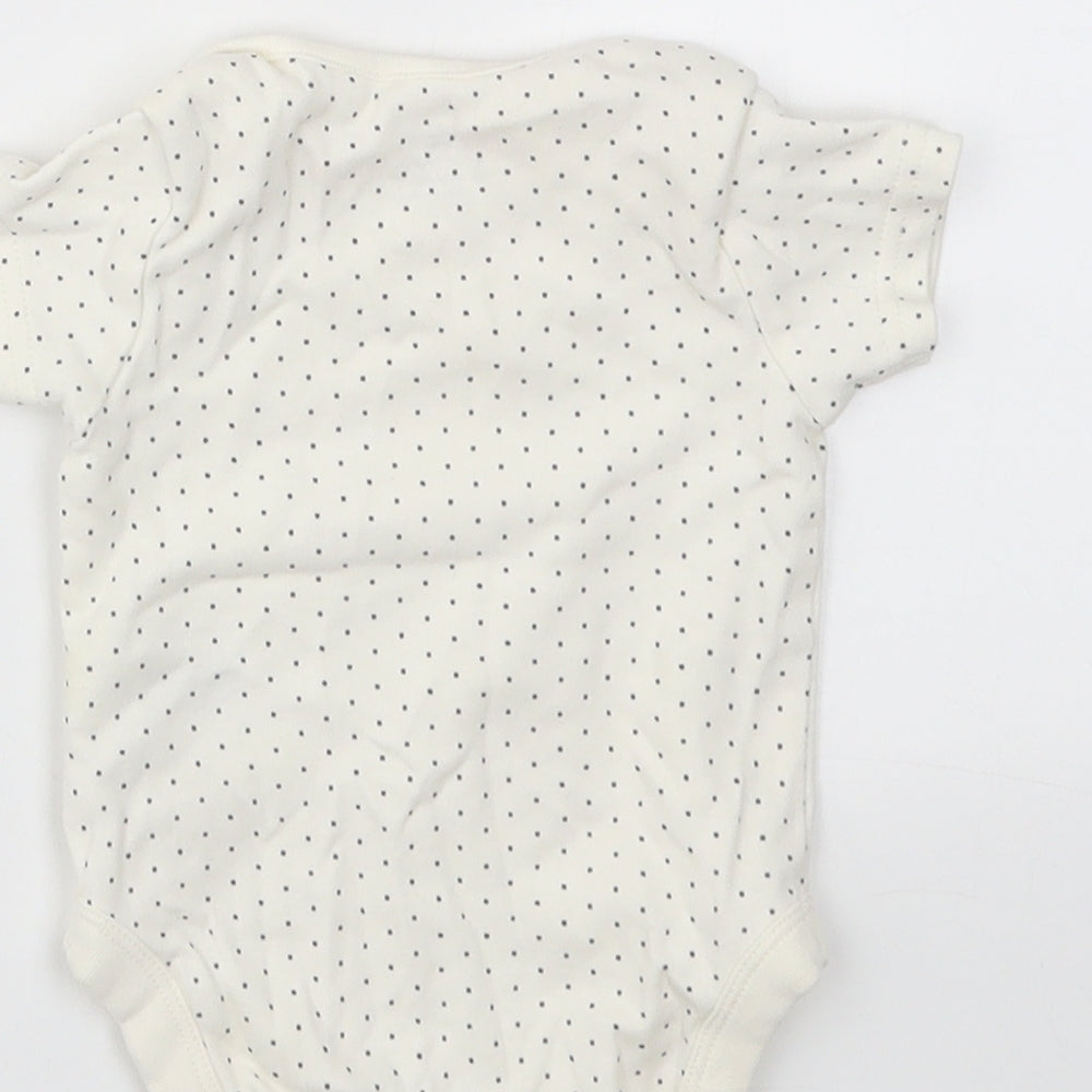 Brand and care label for Next girls’ ivory animal print babygrow one-piece, size 0-3, months