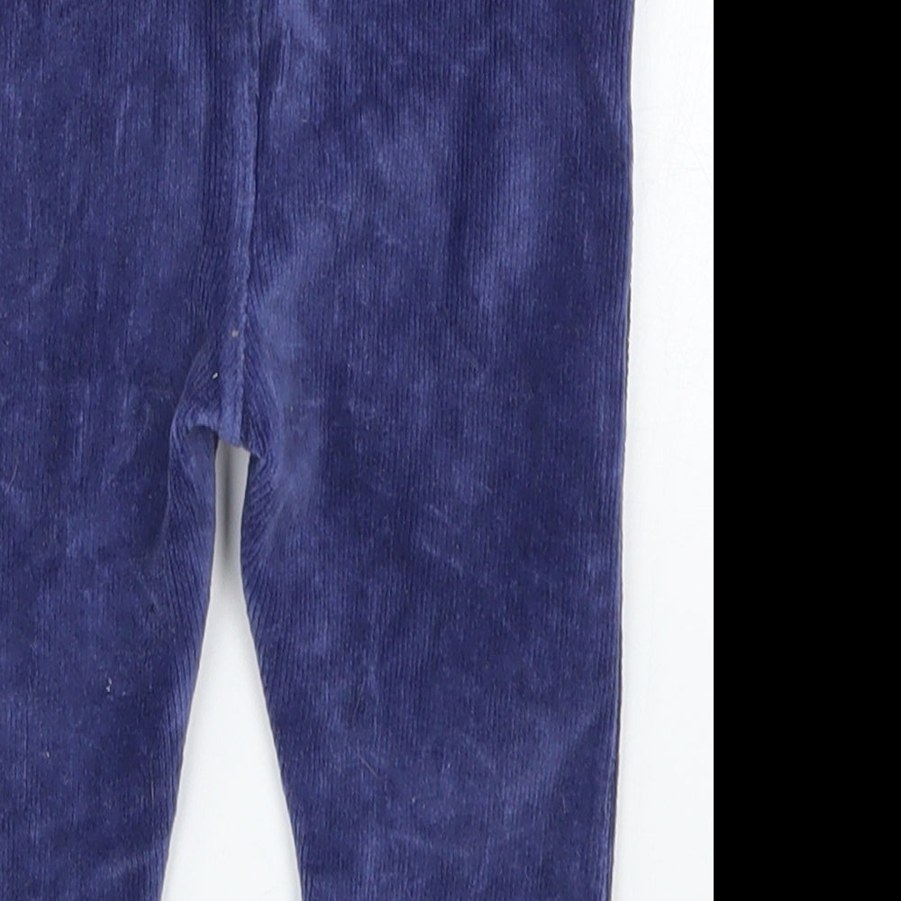 Brand and care label for JoJo Maman Bébé boys’ blue corduroy capri trousers, size 6-9, months