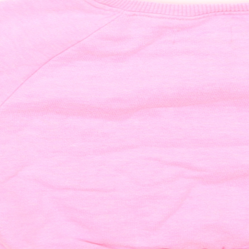 Brand and care label for Next girls’ pink jumper, size 3-6, months