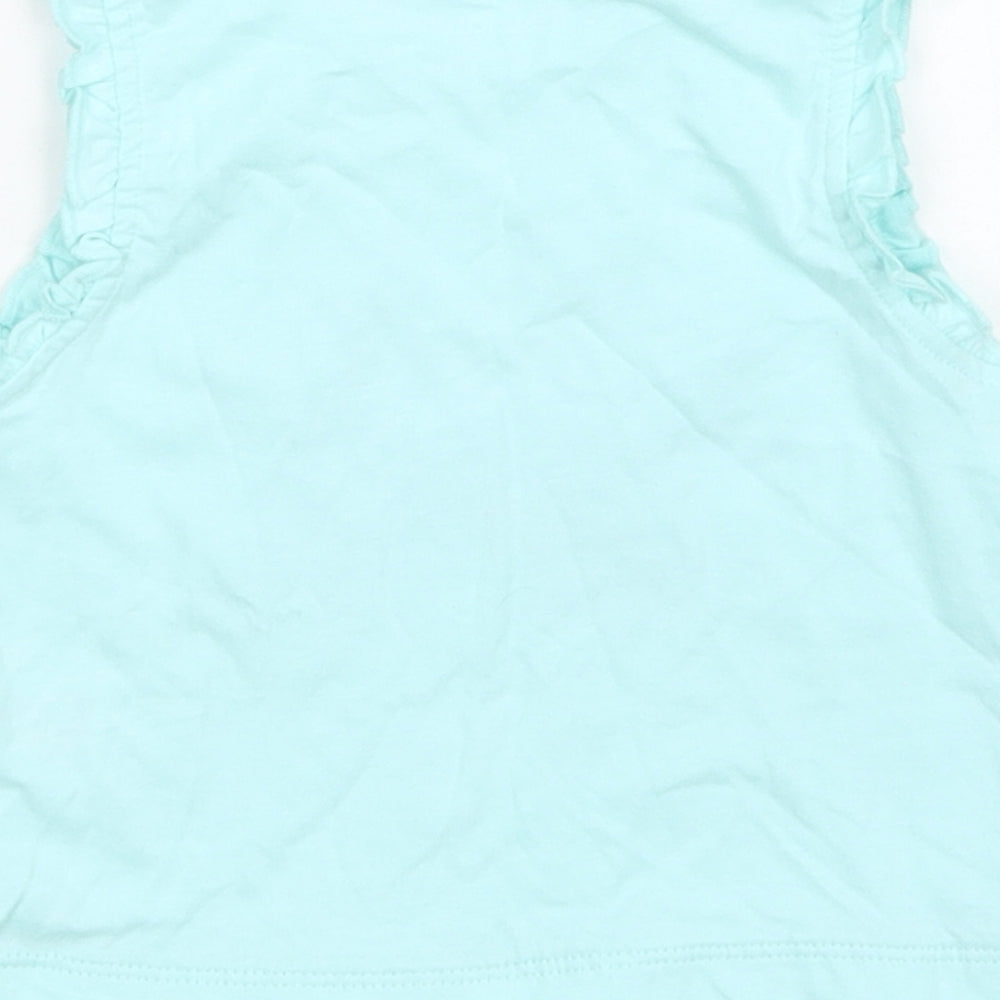 Brand and care label for Studio girls’ blue basic tank, size 12-18, months