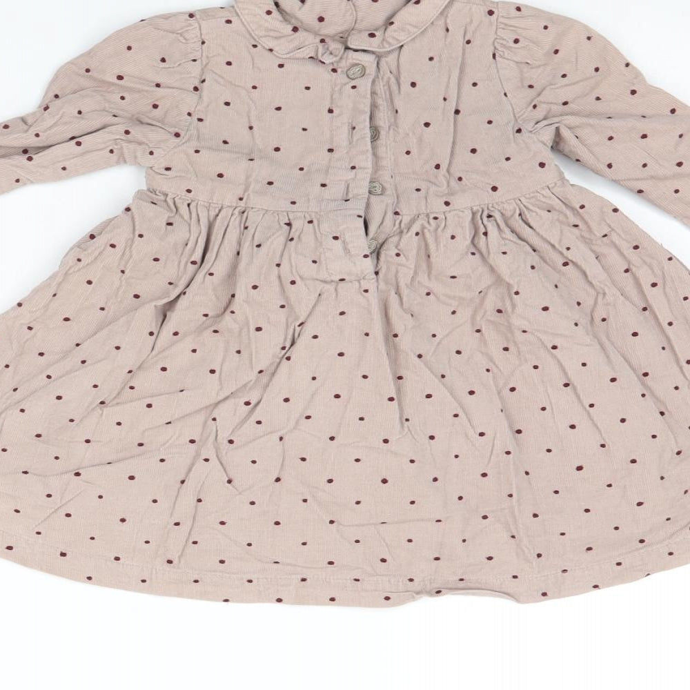 Brand and care label for Marks & Spencer girls’ beige polka dot corduroy fit & flare, size 9-12, months