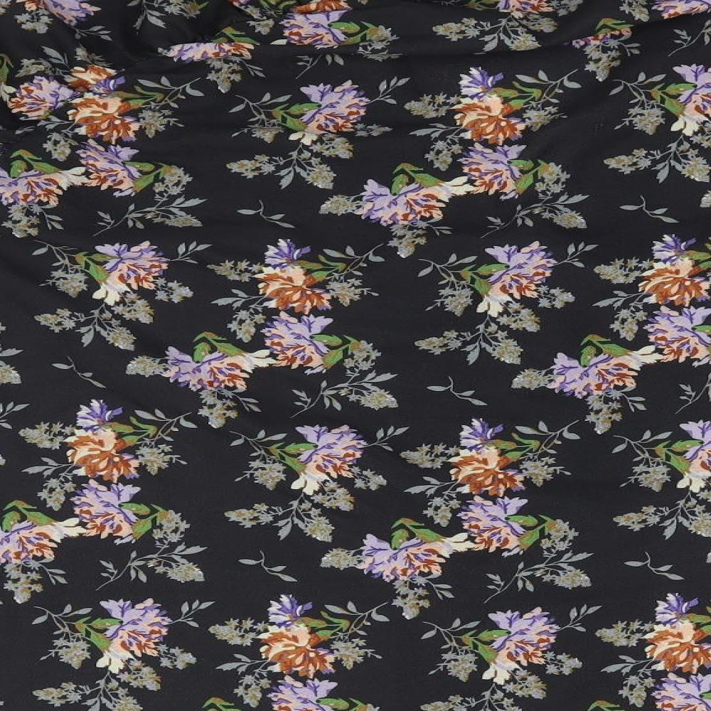Brand and care label for In the Style women’s black floral basic blouse, size UK 10