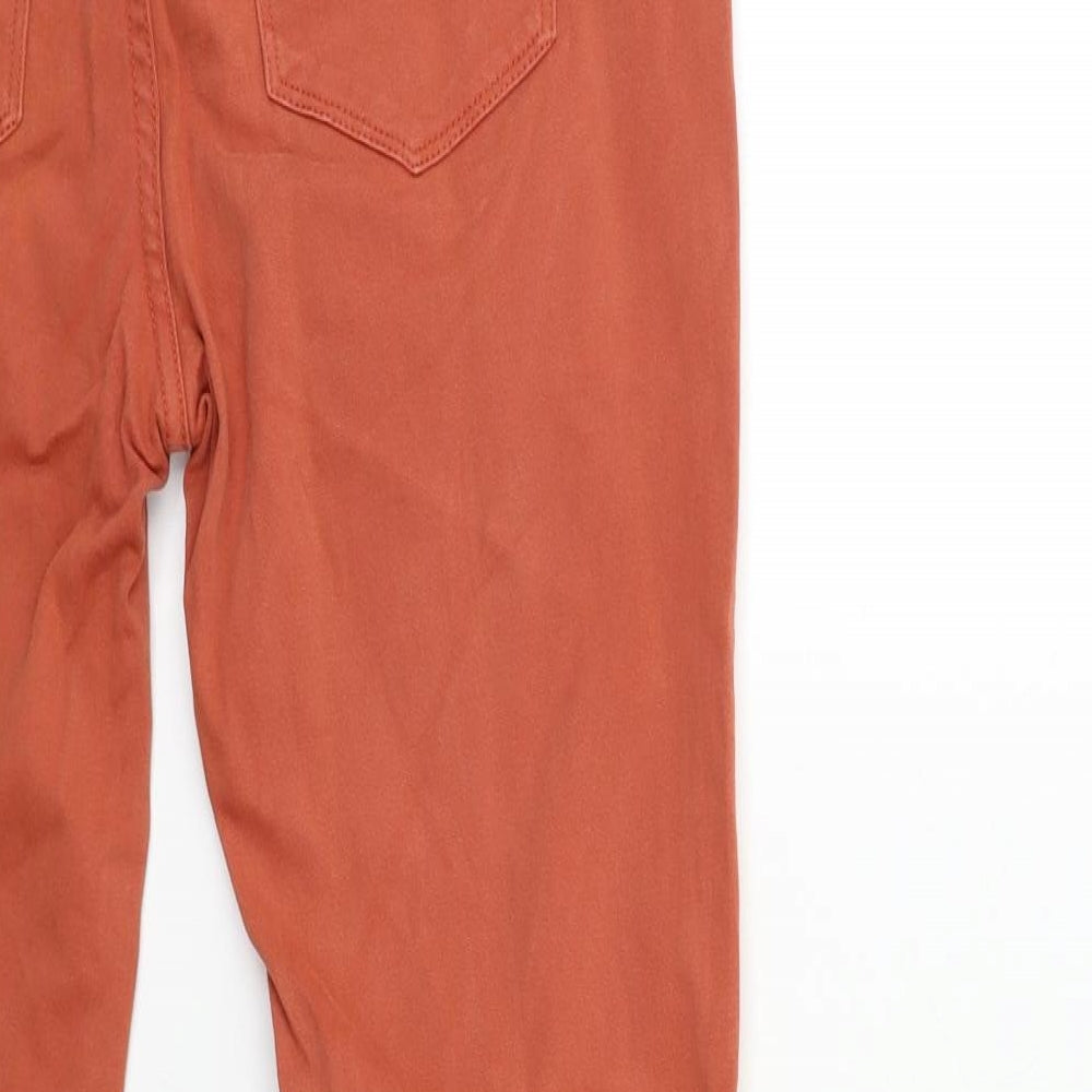 Brand and care label for BDG men’s brown denim skinny jeans, size 28, in, 29-inch leg