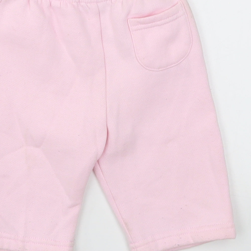 Brand and care label for Early Days girls’ pink capri leggings, size 0-3, months