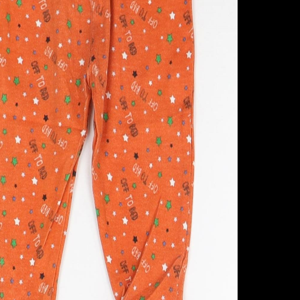 Brand and care label for Early Days girls’ orange geometric jogger leggings, size 6-9, months