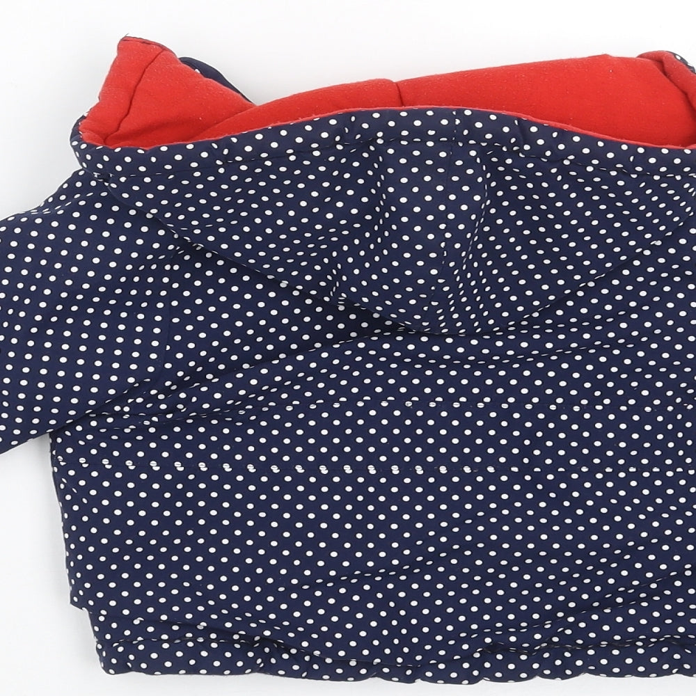 Brand and care label for Jack & Lily girls’ blue polka dot jacket, size 6-9, months