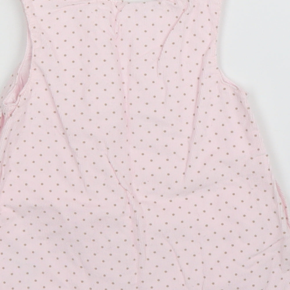 Brand and care label for Mothercare girls’ pink corduroy a-line, size 3-6, months