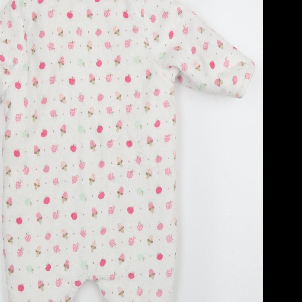 Brand and care label for Mothercare girls’ white babygrow one-piece, size 3-6, months