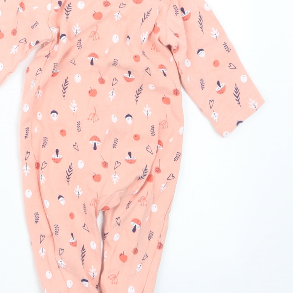Brand and care label for Sterling girls’ pink geometric babydoll one piece, size 0-3, months