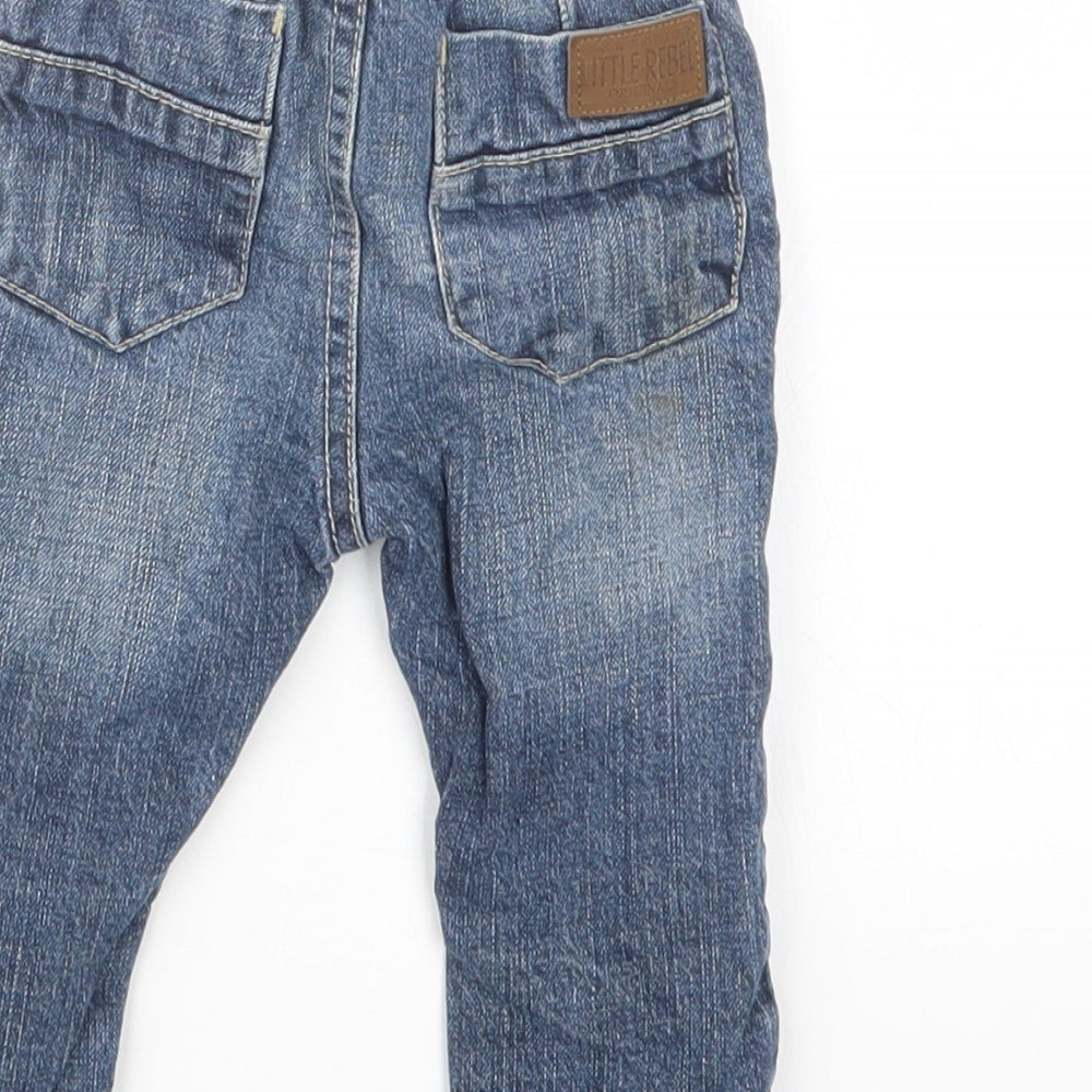 Brand and care label for Rebel boys’ blue denim cargo jeans, size 9-12, months