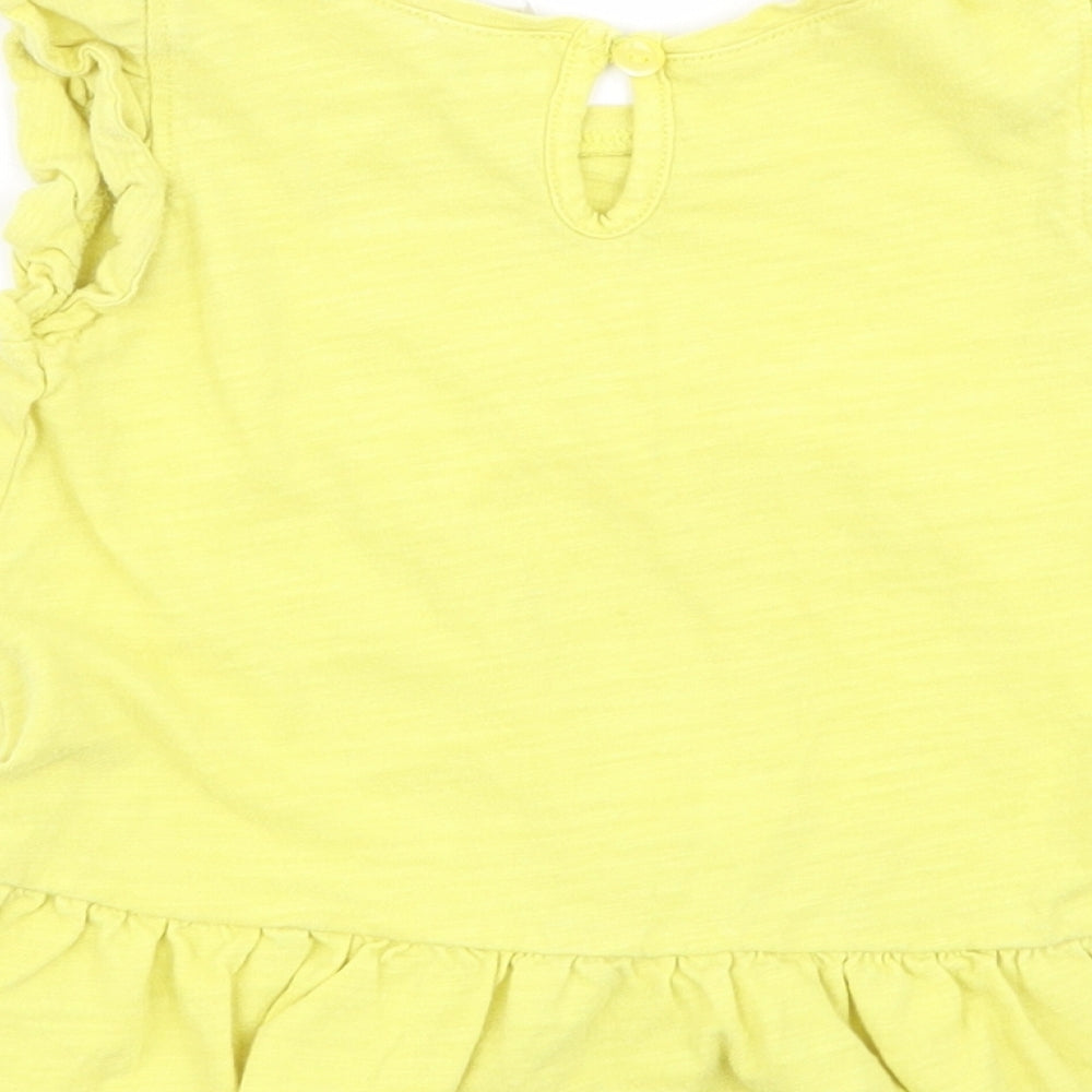 Brand and care label for Gap girls’ yellow basic tank, size 18-24, months