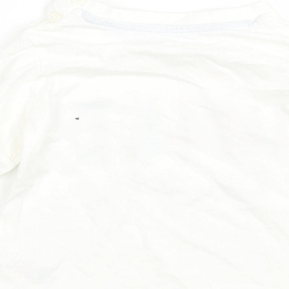 Brand and care label for Matalan girls’ white basic t-shirt, size 9-12, months