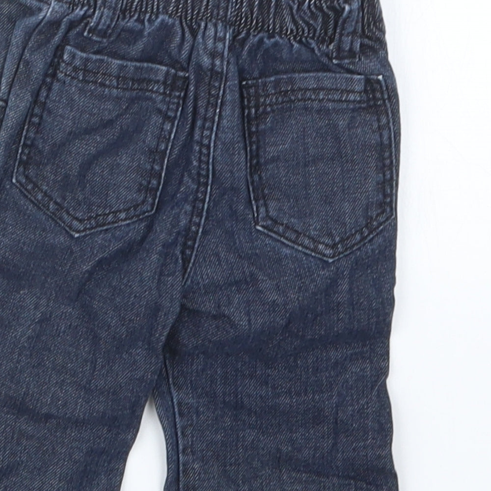 Brand and care label for Mothercare boys’ blue denim cargo jeans, size 0-3, months