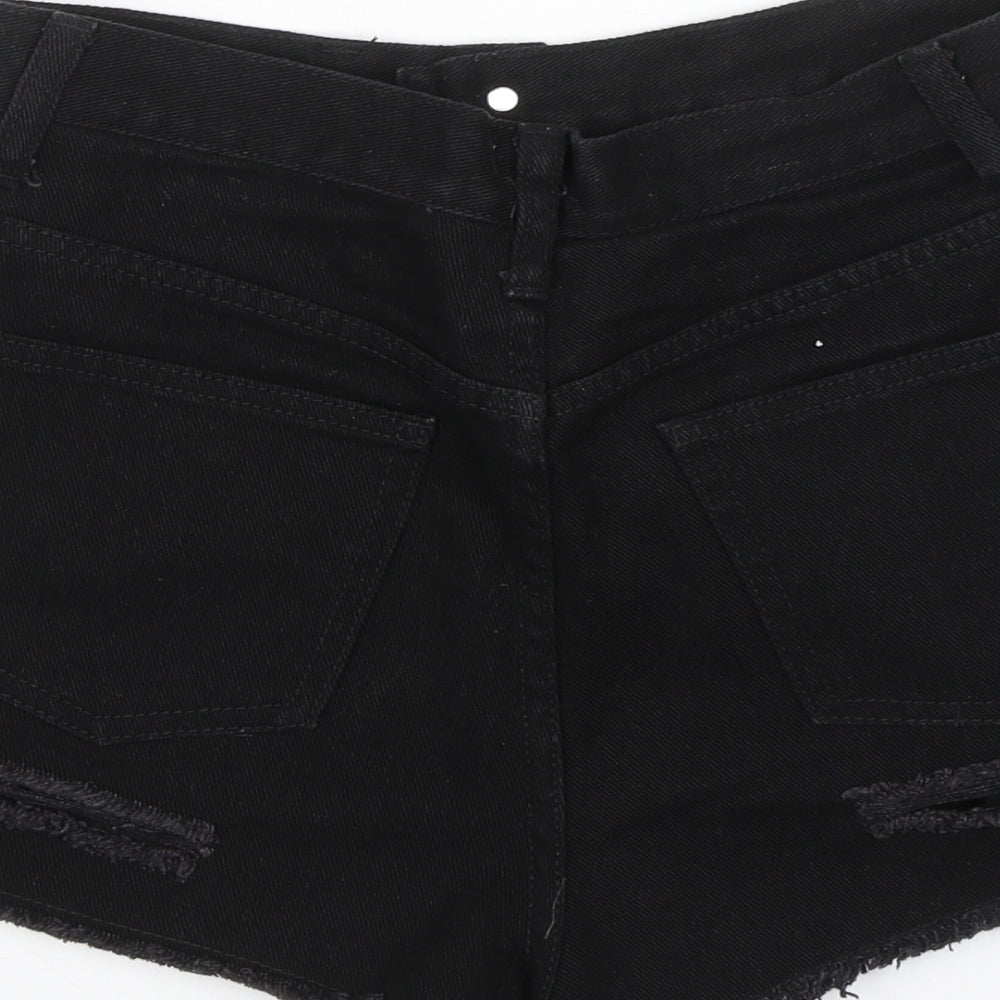 Brand and care label for Missguided women’s black denim mom shorts, size UK 8