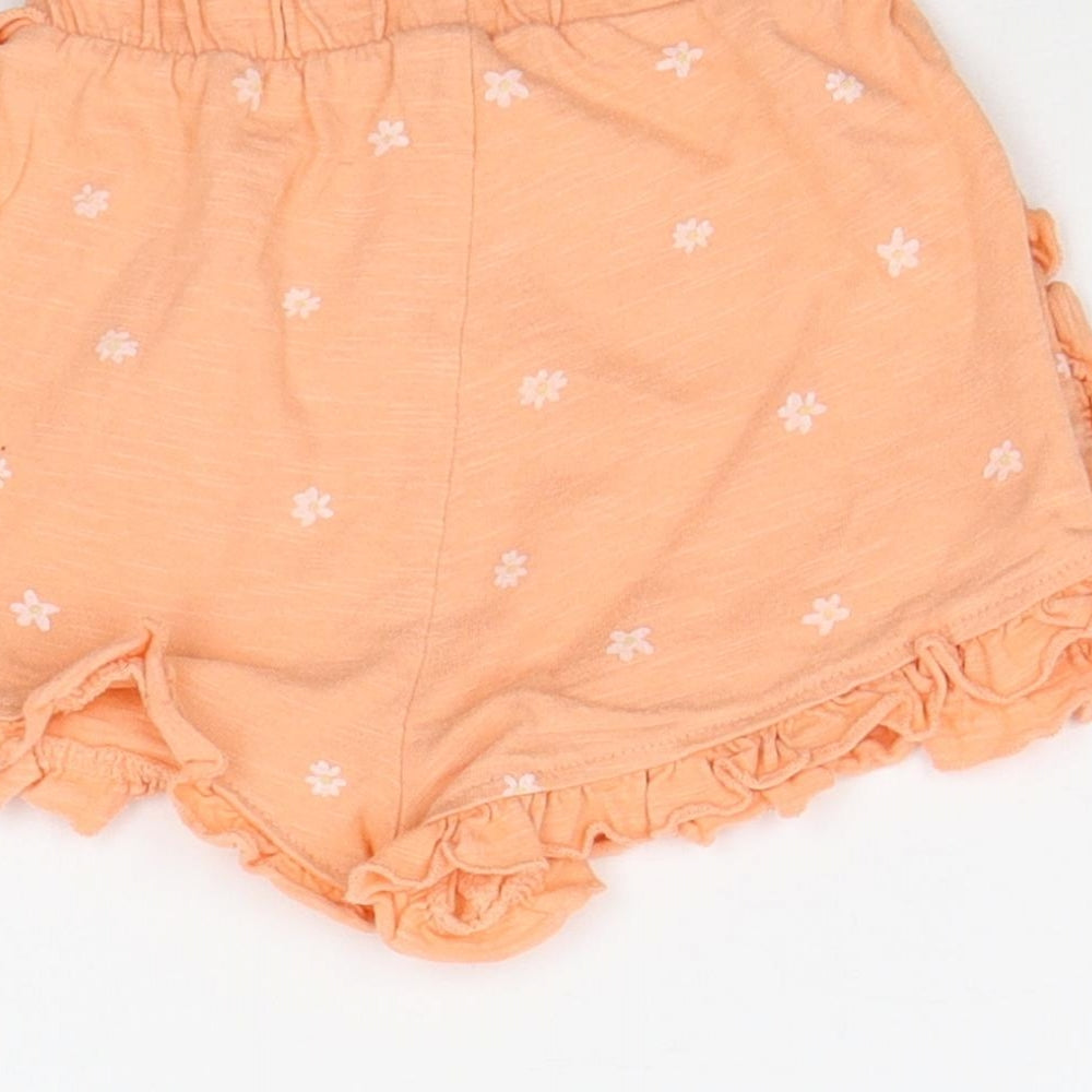 Brand and care label for George girls’ orange geometric cropped jeans, size 12-18, months
