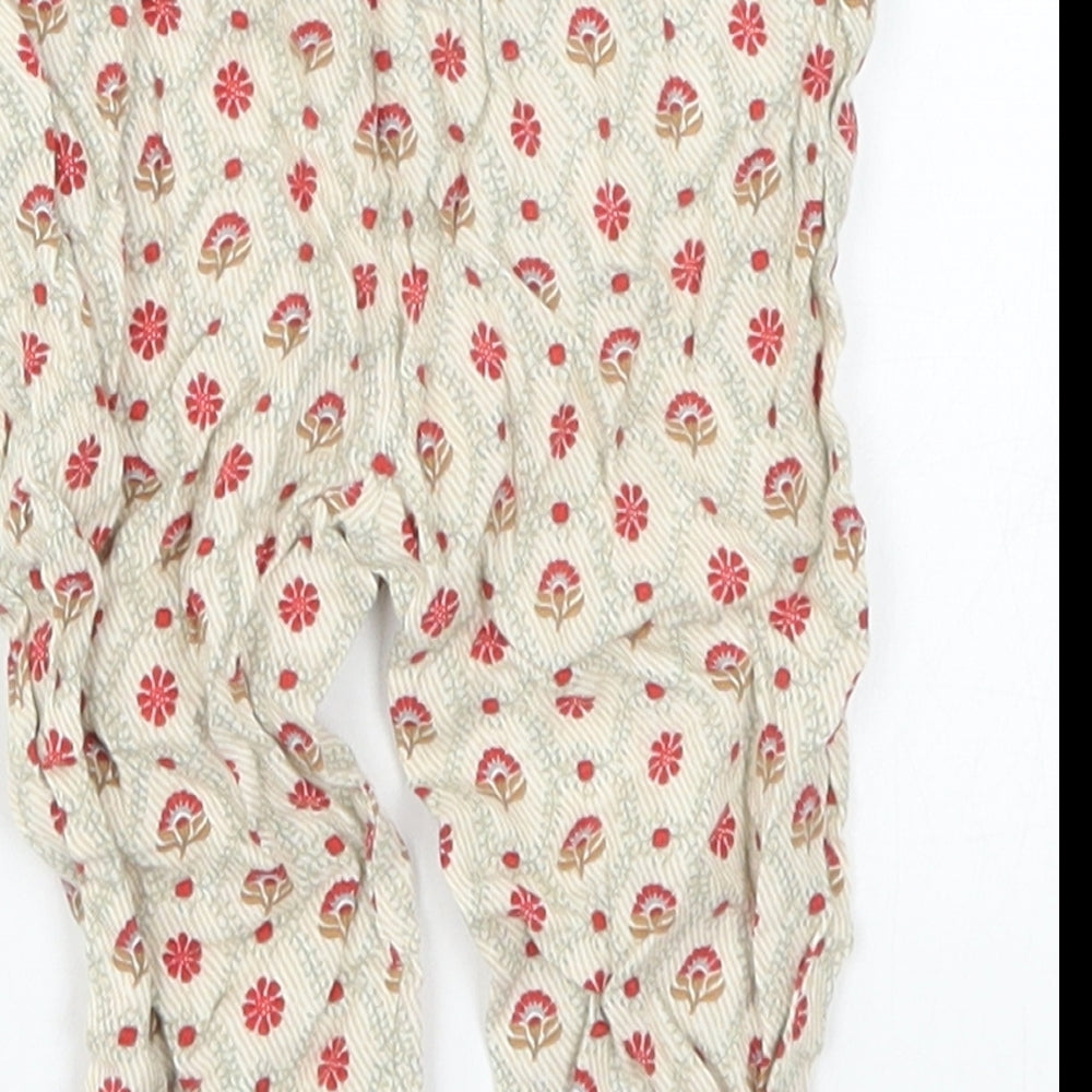Brand and care label for Zara girls’ beige floral capri trousers, size 6-9, months