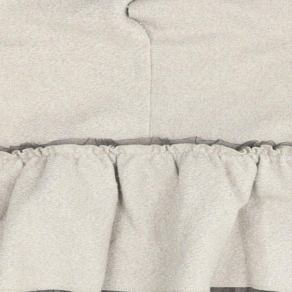 Brand and care label for Zara girls’ beige a-line, size 9-12, months