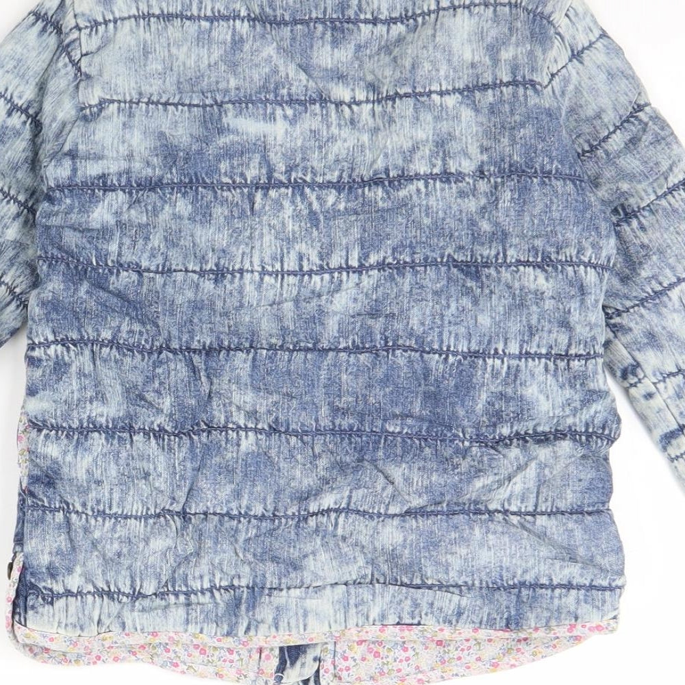 Brand and care label for Next girls’ blue jacket, size 4, years