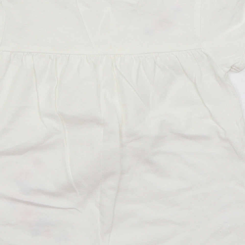 Brand and care label for Little Nutmeg Baby White Basic T-Shirt, size 12-18, Months