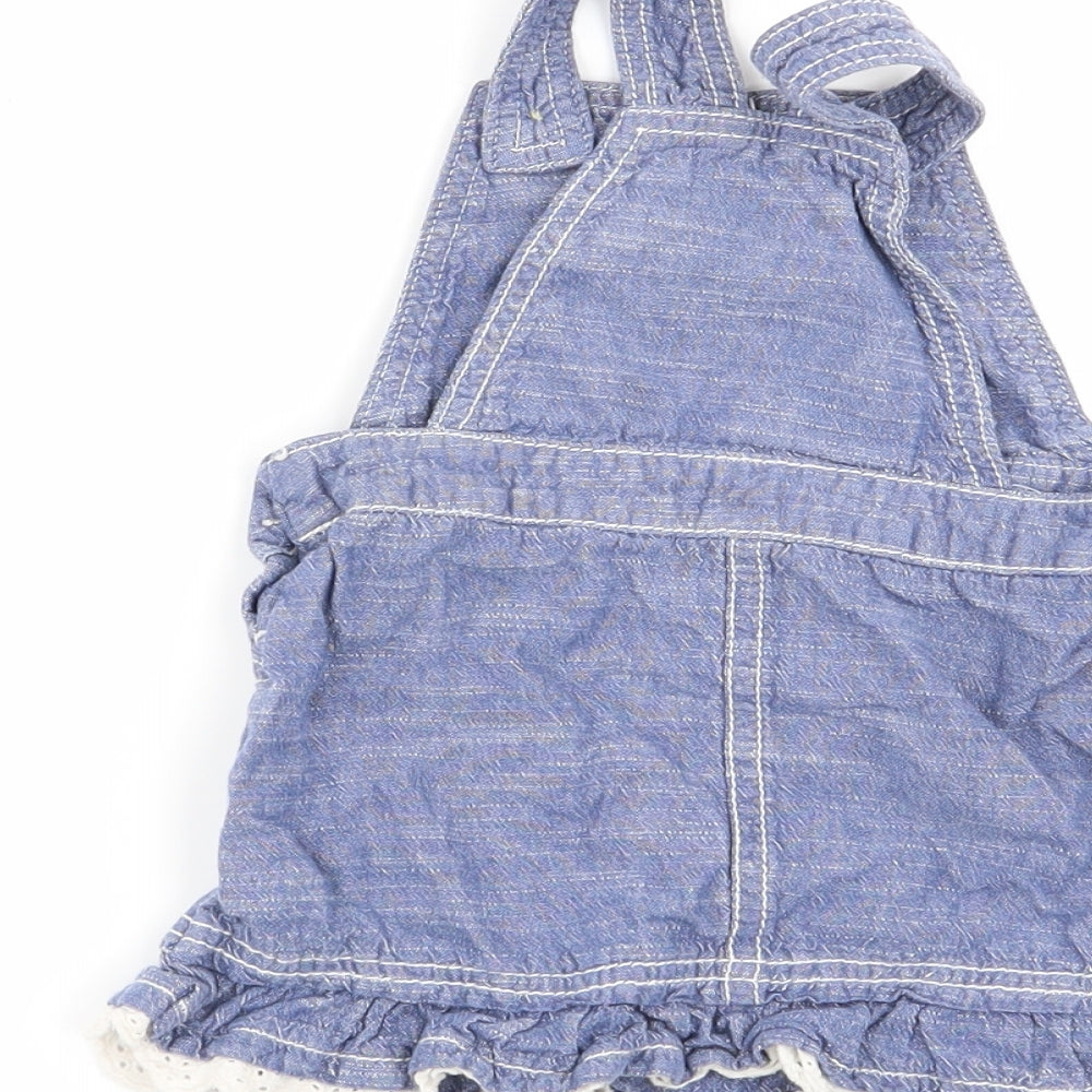 Brand and care label for Asda George girls’ blue pinafore/dungaree dress, size 9-12, months