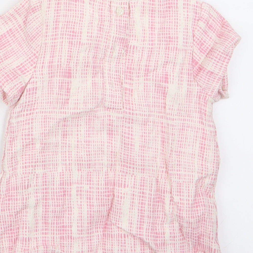 Brand and care label for Marks & Spencer girls’ pink geometric basic t-shirt, size 9-12, months