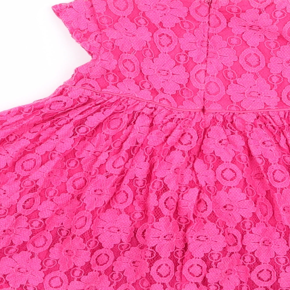 Brand and care label for Marks & Spencer girls’ pink floral fit & flare, size 6-9, months