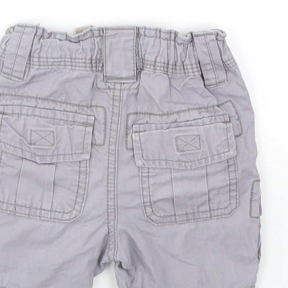 Brand and care label for LOGG boys’ grey capri trousers, size 3-6, months