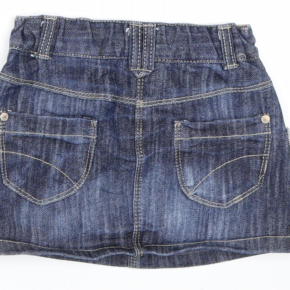 Brand and care label for Next girls’ blue denim mini skirt, size 12-18, months