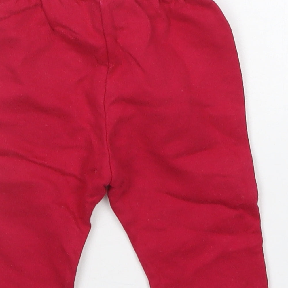 Brand and care label for teddy boom girls’ pink sweatpants, size 0-3, months