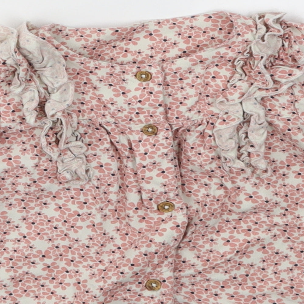 Brand and care label for Marks & Spencer girls’ pink floral fit & flare, size 6-9, months