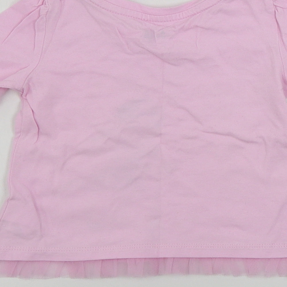 Brand and care label for Gap girls’ pink basic t-shirt, size 18-24, months