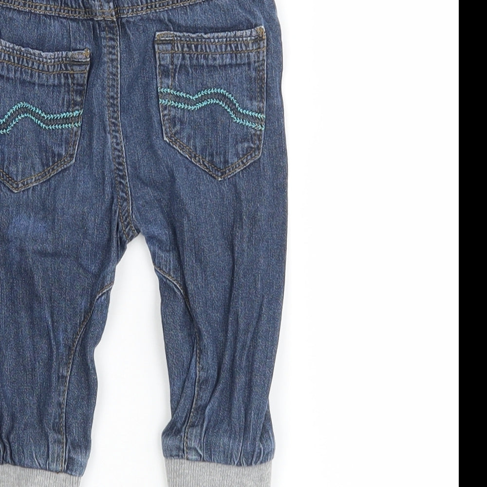 Brand and care label for Baby boys’ black jogger jeans, size 6-9, months