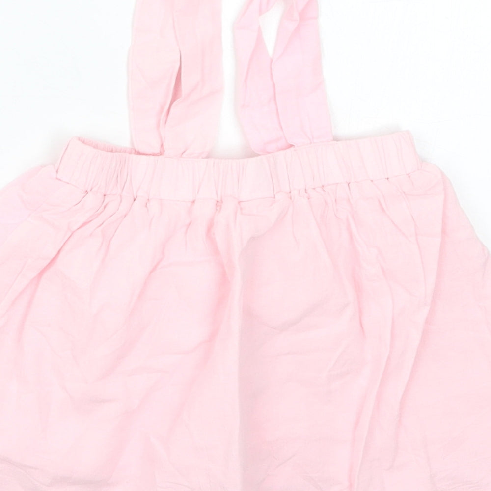 Brand and care label for Pat Pat girls’ pink skater skirt, size 3-6, months - suspenders