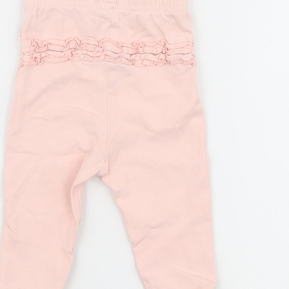 Brand and care label for George girls’ pink jogger leggings, size 3-6, months