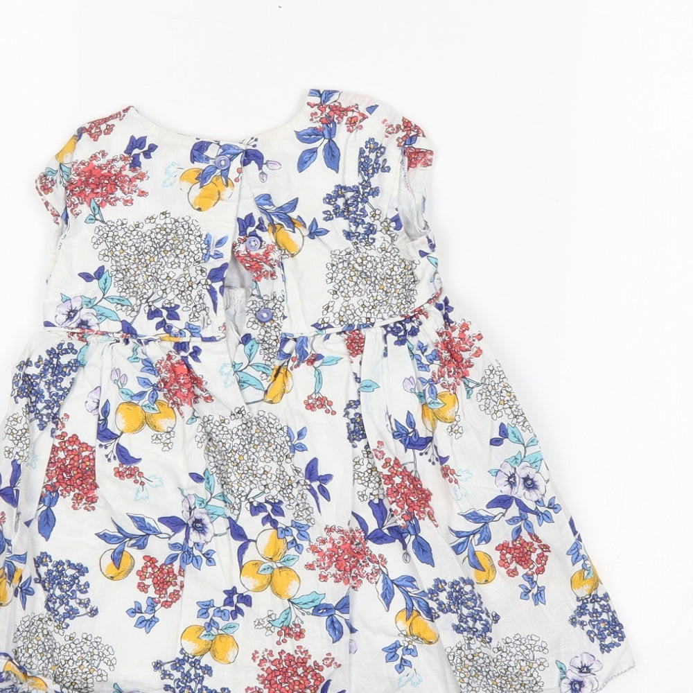 Brand and care label for Marks & Spencer girls’ multicoloured floral shift, size 6-9, months
