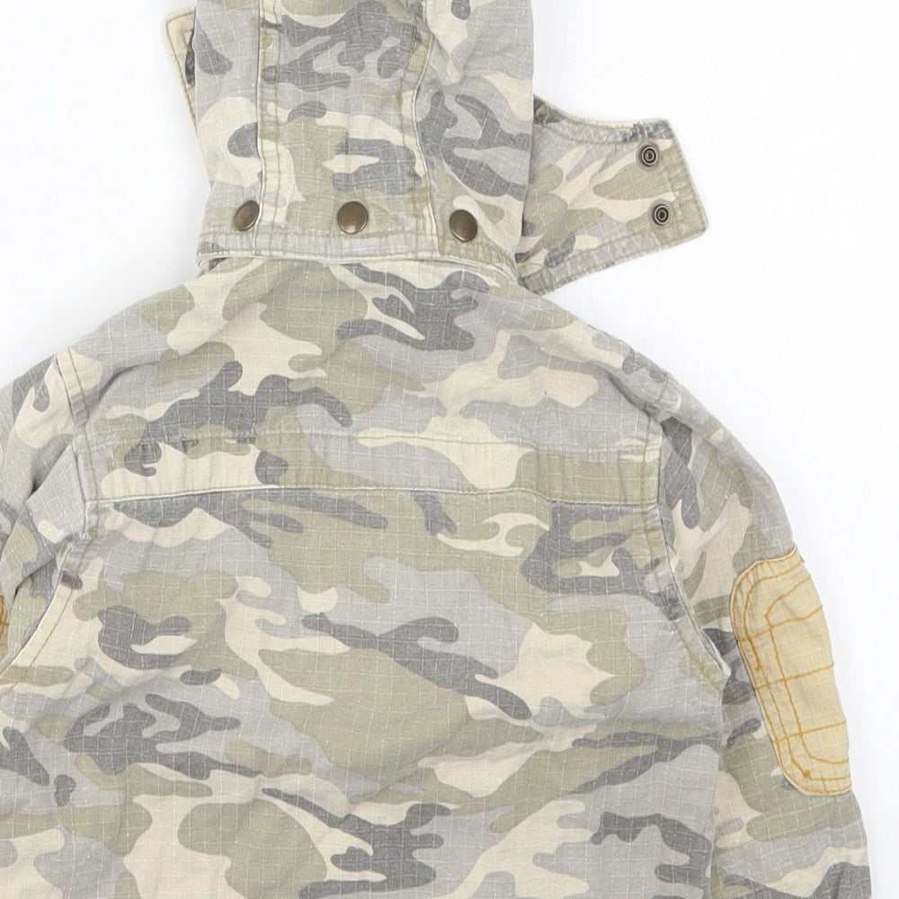 Brand and care label for Rohm & Emmy boys’ beige camouflage jacket, size 2, years